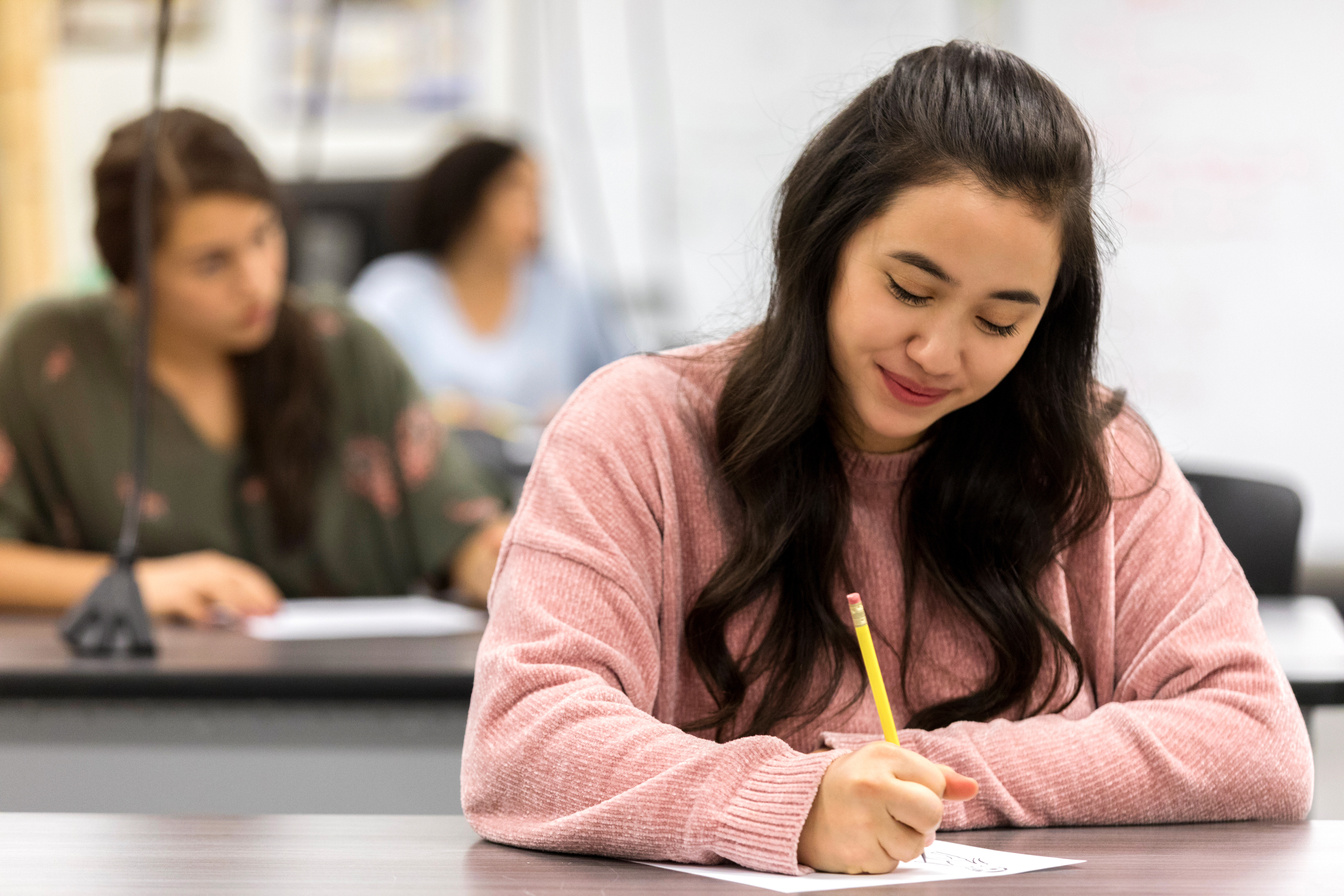 Confident student taking test